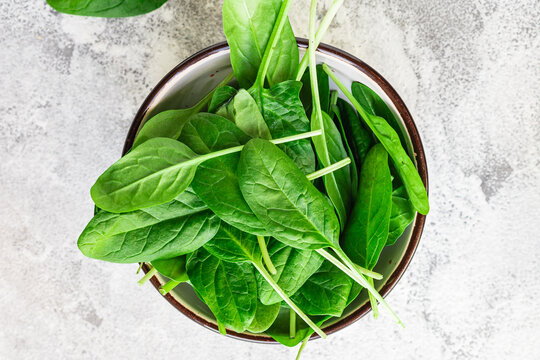 spinach fresh green petals leaves for cooking healthy food portion on the table cooking meal snack outdoor top view copy space for text food background rustic image keto or paleo diet vegan or vegetar