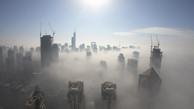 Time lapse of Dubai JBR and Marina covered in fog