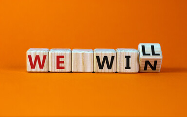 We will win symbol. Turned a wooden cube and changed words we will to we win. Beautiful orange...