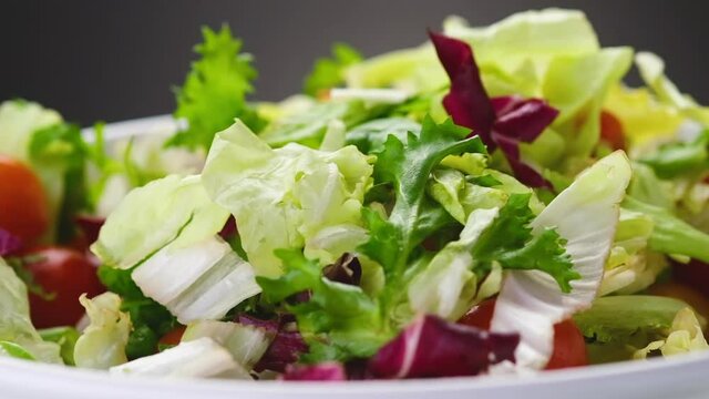 Fresh Salad Falling Into Bowl 