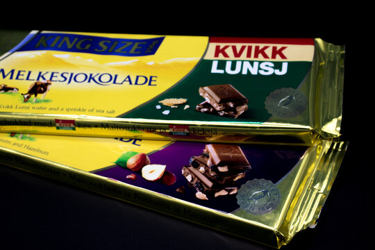 Oslo city, Norway 09/06/2019 Norwegian Chocolate Freia Melkesjokolade in different packages lies on a black isolated background