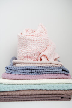 photo in light pastel colors, a stack of towels on a light background