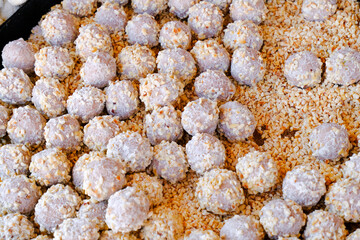 white chocolate with nuts round sweets close-up. Food, dessert top view. Handmade, craft sweats, biscuits.