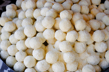 Sweet coconut round sweets close-up. Food, dessert top view.  Handmade, craft sweats, biscuits. 