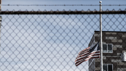 American flag behind bars