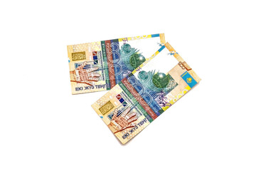 Obraz na płótnie Canvas Banknotes of the Republic of Kazakhstan isolated on a white background.