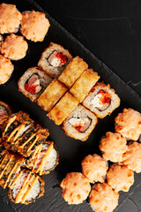 set of rolls on a black textured background    top view