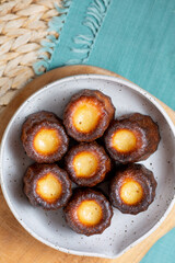 A plate of Canelés de Bordeaux