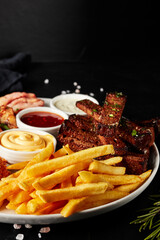 plate of snacks on black textured background