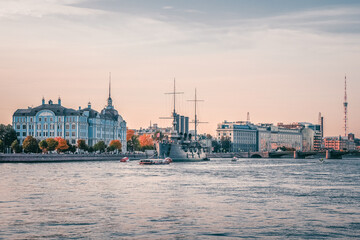 Cruiser Aurora view from the Neva river in the evening. The battleship sparkled Great October...
