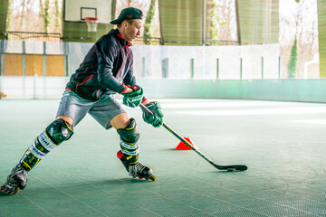 Fototapeta premium Inline skating, young man skating inline
