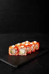 rolls on a black board on a dark textured background