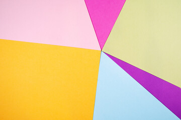 Abstract paper background with red,green,purple,pink and blue colors,top view.