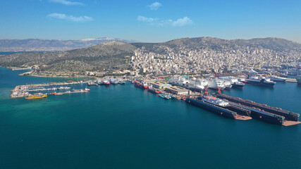 Aerial drone photo of small port next to shipyard and ship repair area of Perama next to island of Salamina, Attica, Greece