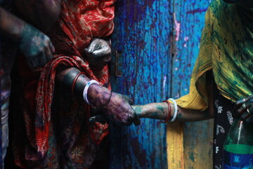 colorful hands of holi holding hands