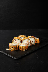 rolls on a black board on a dark textured background