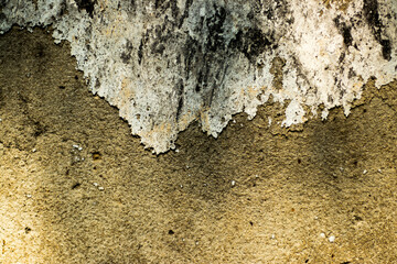 Concrete wall texture with very rough, damaged surface