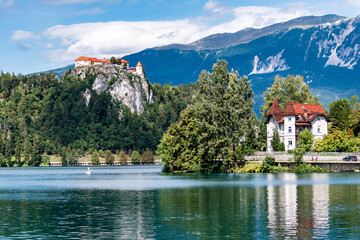 Fototapeta na wymiar View of the builds and mountains from Lake Bled.