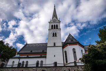 Church with a grey patterned roof in Bled.