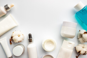 Flat lay composition with skin care products on white background