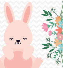 cute rabbit sitting next to the flowers