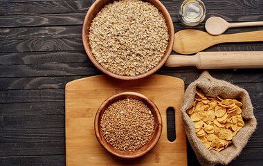 Wheat in a plate of cooking utensils and wooden board