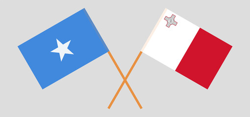 Crossed flags of Somalia and Malta. Official colors. Correct proportion