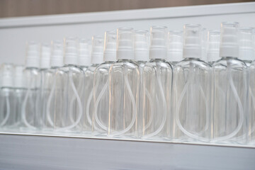 spray bottles for various cosmetic liquids on a white background