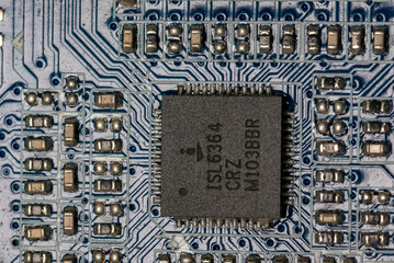 microcircuits and a square motherboard on a motherboard inside a personal computer
