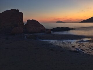 Fototapeta na wymiar Mediterranean beach with no people at sunset.