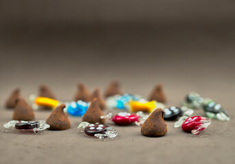 Various chocolate truffles and candies on a table