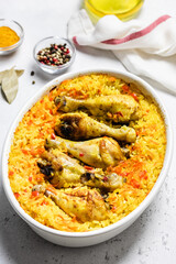 Curried spicy chicken rice casserole in baking dish. Space for text.