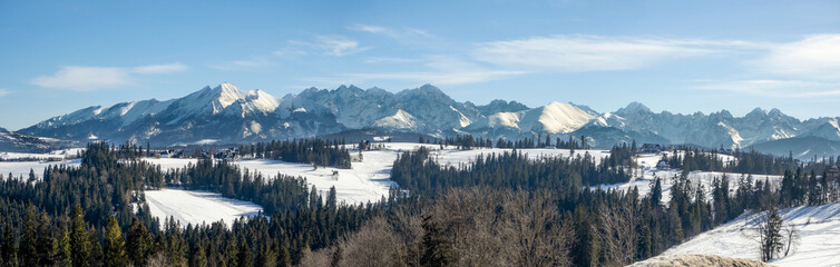 Wide panorama of Tatra mountains , eastern part, in winter viewed from Bukowina Tatrzanska in Poland © nahlik