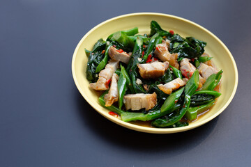 Stir fried chinese kale with crispy pork belly