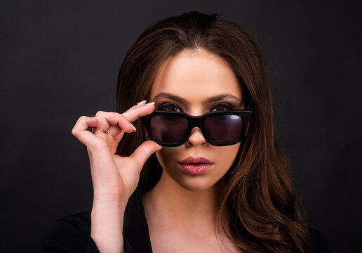 Closeup girl with summer glasses. Fashion trendy woman in sunglasses.