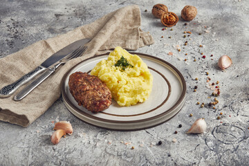 Mashed potatoes with cutlet, light background
