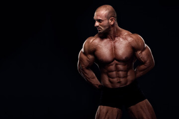 Strong Muscular Men Flexing Muscles