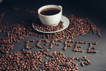 a cup of coffee for breakfast and the inscription arabica drink on the table