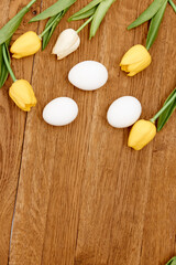 chicken eggs Yellow tulips decoration Spring holiday Copy Space