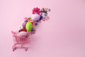 Happy Easter big hunt or sale banner with Colorful Eggs in shopping cart on pink background.