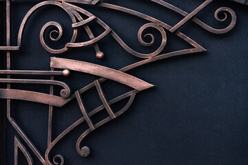 Beautiful decorative rectilinear forged elements of a metal gate