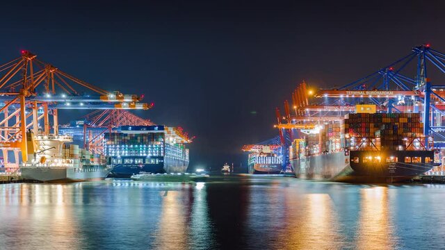 Container ship loading and unloading in deep sea port, Low angle View of business logistic import and export freight transportation by container ship, Container loading cargo freight ship, Time Lapse