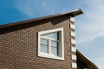 Modern brick house with slanting window