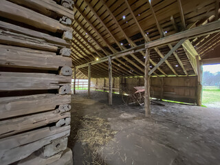 Inside of an old wooden barn