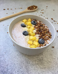 smoothiebowl with muesli, mango and berries