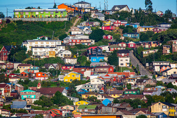 Chile, Puerto Montt. Painted houses and hillside neighborhood.
