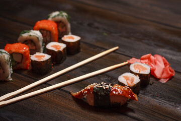 with sushi chopsticks ginger delicacy wooden background meal