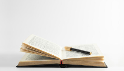 Open holy bible book on the table. Scripture. A pen