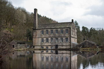 The mirror image in water of the 19th-century cotton mill called Gibson Mill, Hardcastle Crags,...
