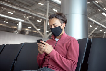 Man traveller wearing mask in airport